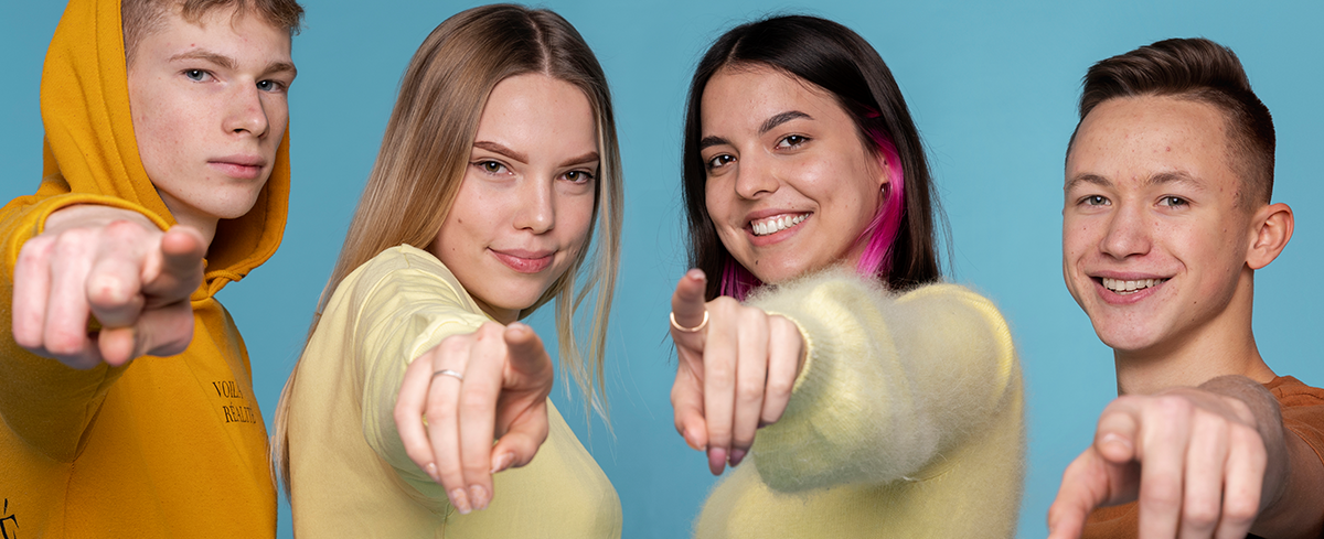 portrait-teenage-friends-pointing-something-front-them